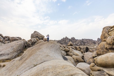 Woman looking at Alabama Hills