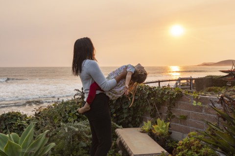 Mother holding daughter