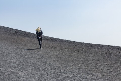 Woman hiking in cinder cone at Craters of the Moon National Monument