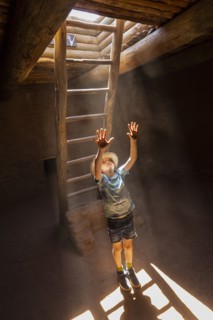 Boy exploring Native American kiva