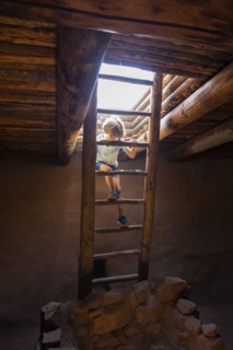 Boy exploring Native American kiva