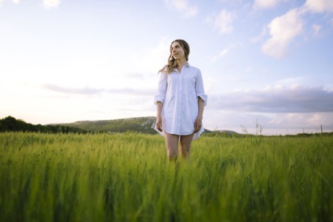 Young woman standing in agricultural field