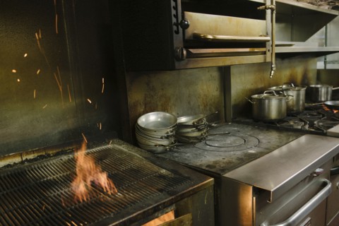 Flaming grill in restaurant kitchen