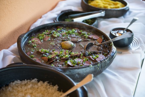 Bowls of traditional beans and rice on buffet table