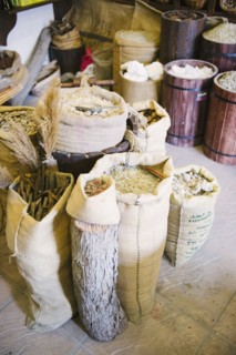 Close up of sacks of grain for sale in market