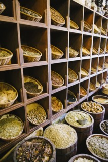 Shelves of sacks of grain for sale in market
