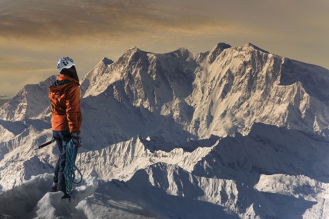 Caucasian hiker admiring scenic view from mountaintop