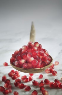 Close up of pomegranate seeds in spoon