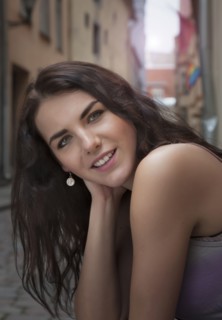 Caucasian woman smiling on city street