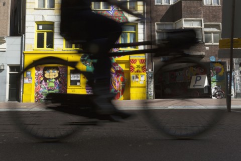Blurred view of bicyclist on city street