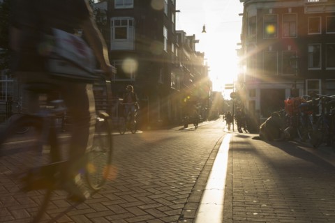 Blurred view of bicyclist on city street