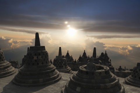 Spires on Temple of Borobudur at sunset