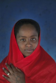 Smiling Black girl wearing headscarf