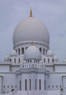 Ornate domed building under cloudy sky