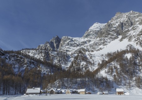 Rural village under snowy mountains