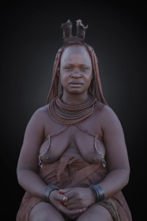 Black woman wearing traditional clothing and jewelry