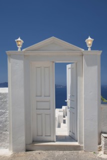 Door on hilltop over seascape