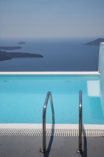 Swimming pool on hilltop over ocean