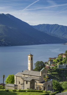Aerial view of waterfront church and Lake Como
