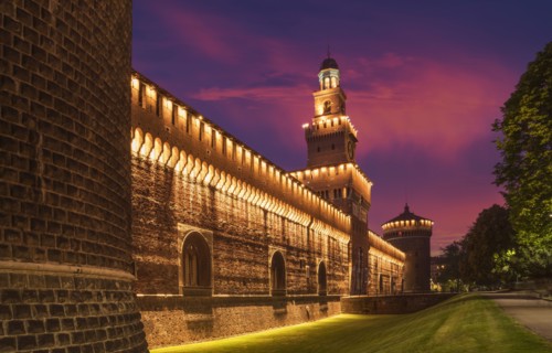 Illuminated tower and castle walls