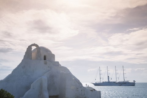 Boat sailing near traditional building