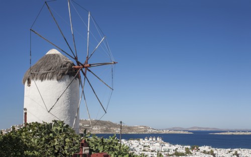 Traditional windmill and Mykonos cityscape