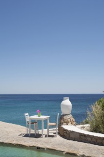 Table on balcony overlooking seascape