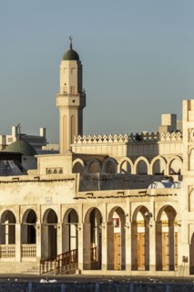 Ornate building and tower under blue sky