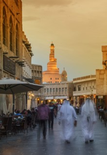 Blurred view of people walking on Doha street