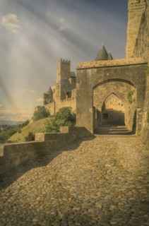 Sunbeams on road to castle in Carcassonne