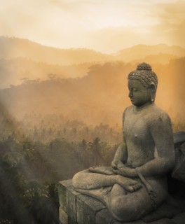 Statue of Buddha at sunset