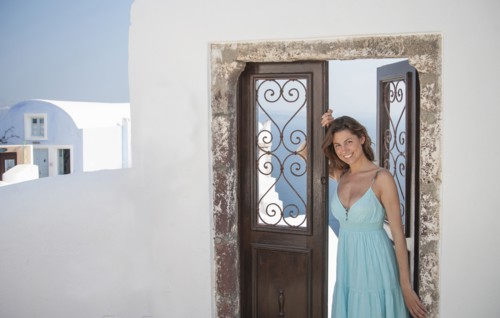 Portrait of smiling Caucasian woman leaning in doorway