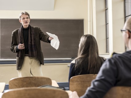 Teacher talking to students in classroom