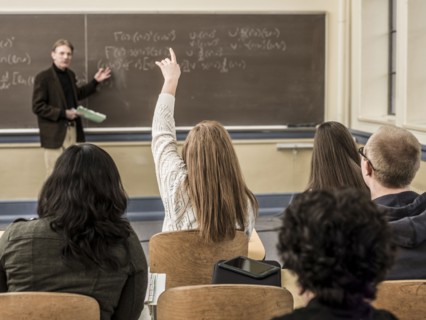Teacher talking to students in classroom