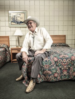 Caucasian man sitting in hotel room