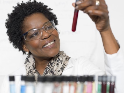 Black scientist examining samples in lab