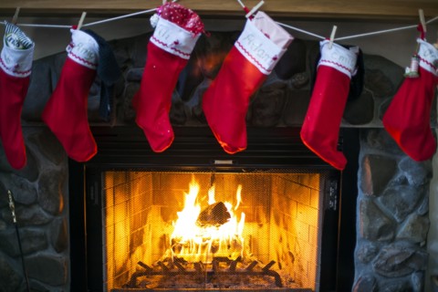 Christmas stockings hanging over fireplace