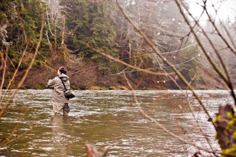 Man fly fishing in rural river