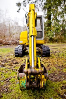 Close up of digger on mossy concrete