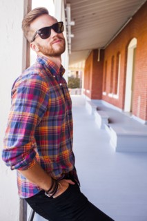 Caucasian man standing under awning