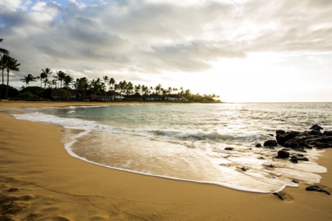Ocean waves washing up on tropical beach