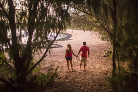 Couple holding hands on beach
