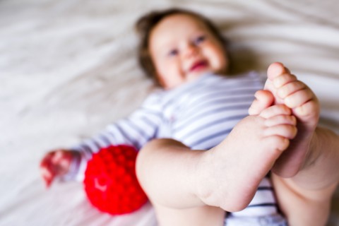 Close up of feet of Caucasian baby girl