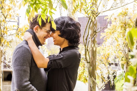 Smiling couple rubbing noses in park