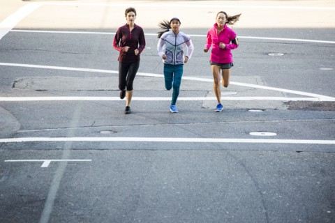 High angle view of women running in city street