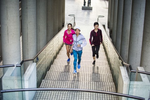 High angle view of women running on staircase