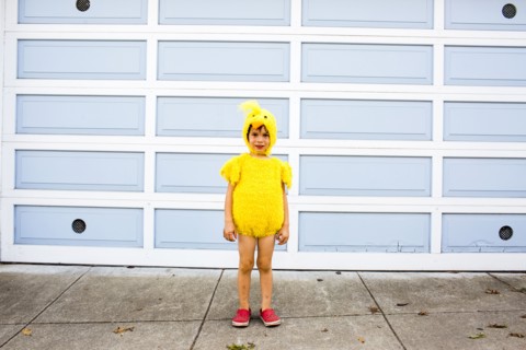 Mixed race boy wearing costume