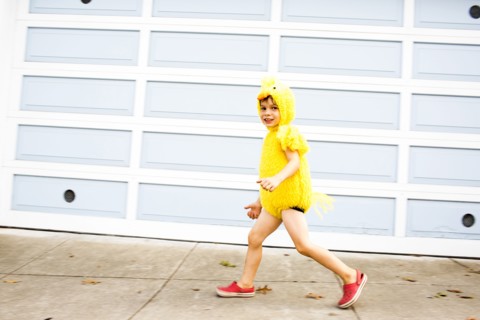 Mixed race boy wearing costume