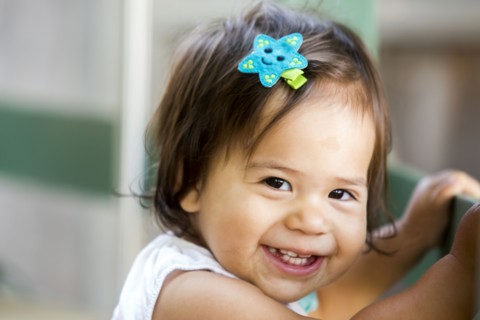 Caucasian baby girl smiling