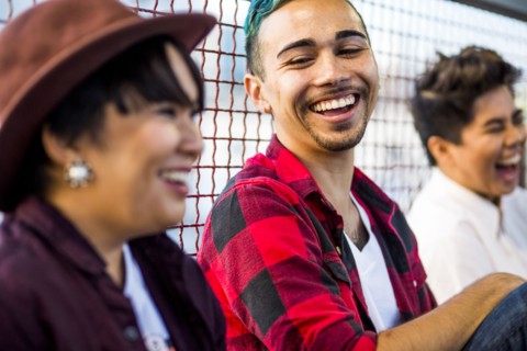 Friends laughing outdoors